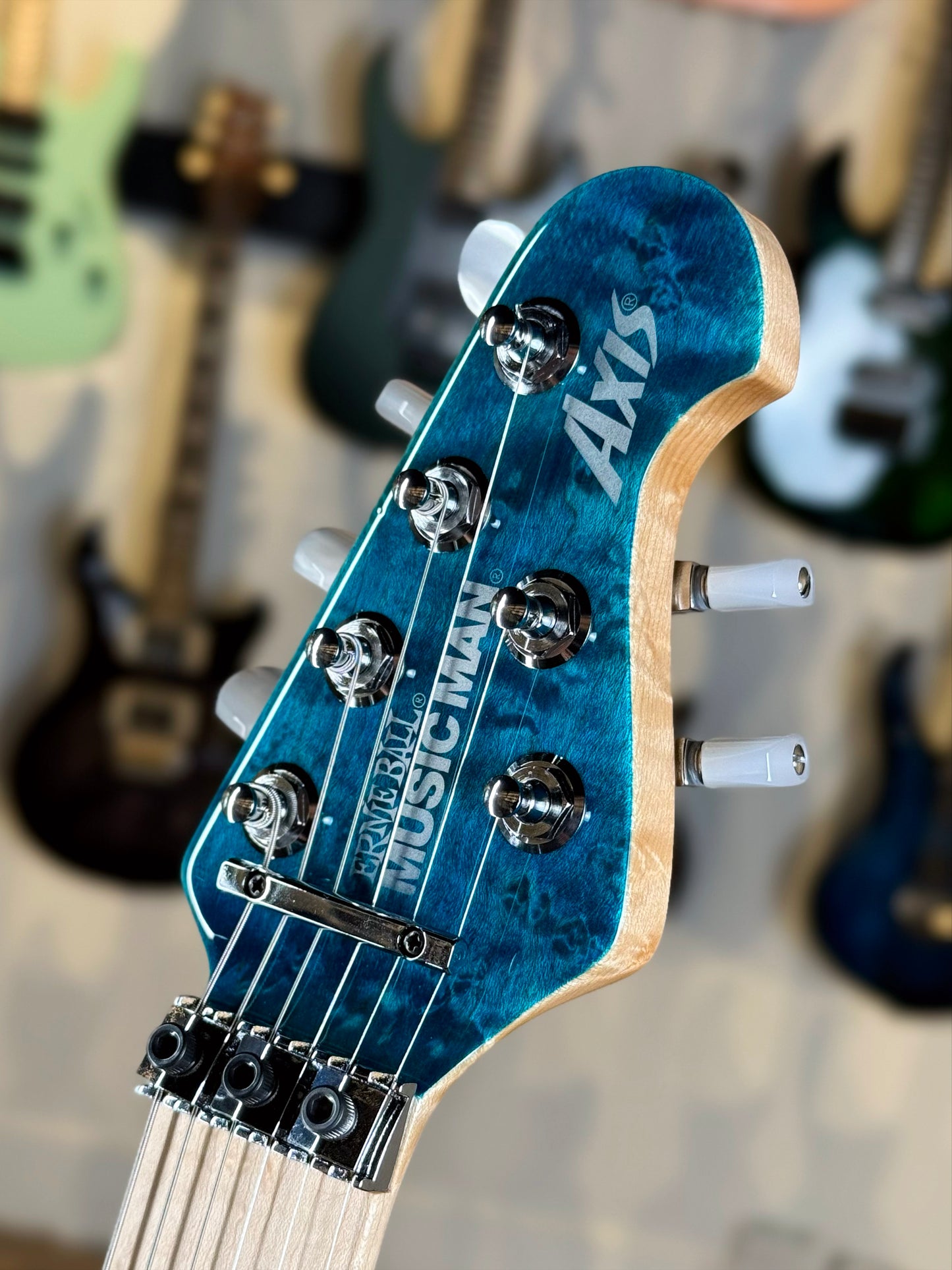 Ernie Ball Music Man 30th Anniversary Axis Limited Edition | Translucent Blue Quilt (#34 of 100)